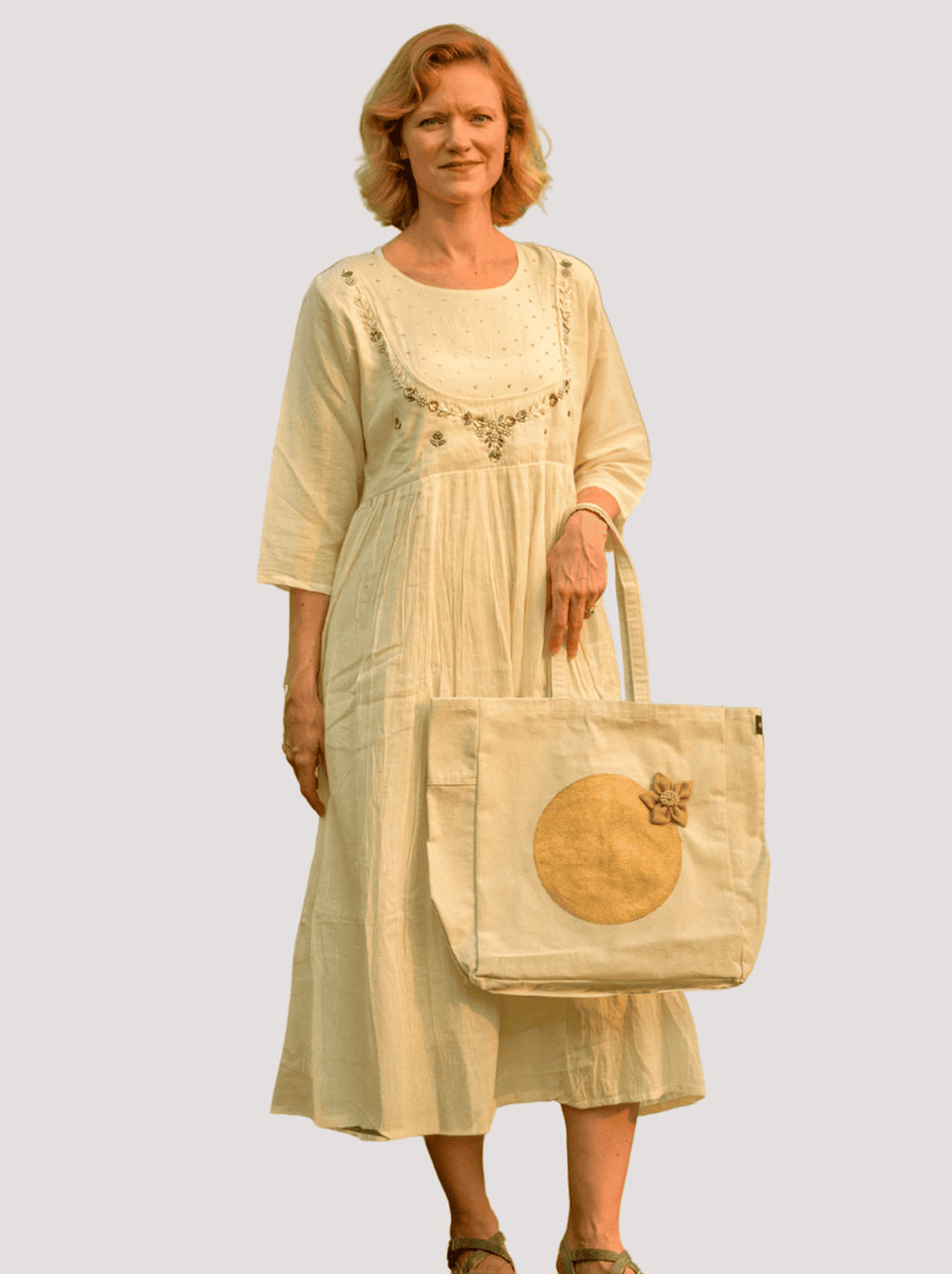 Woman holding a beige tote bagbackground