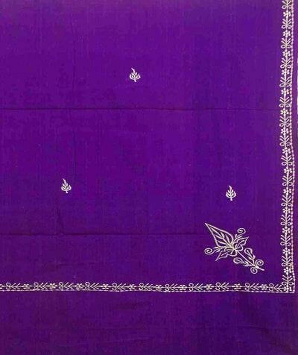 Purple fabric with white embroidery